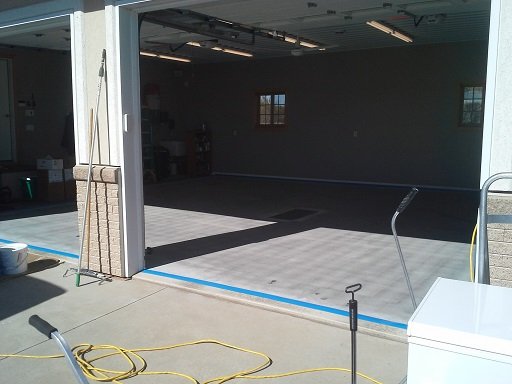 Floor is clean, edges are masked, and ready for coating.